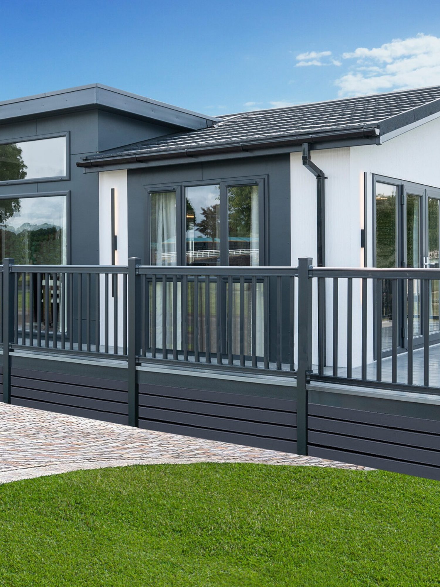 green field with tree in blue sky