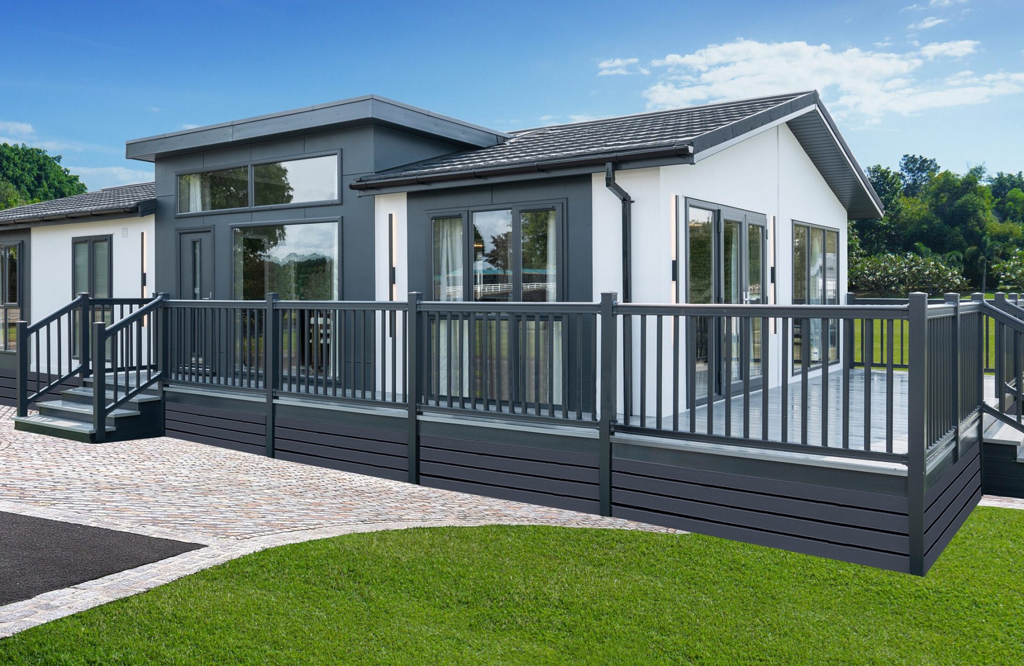 green field with tree in blue sky